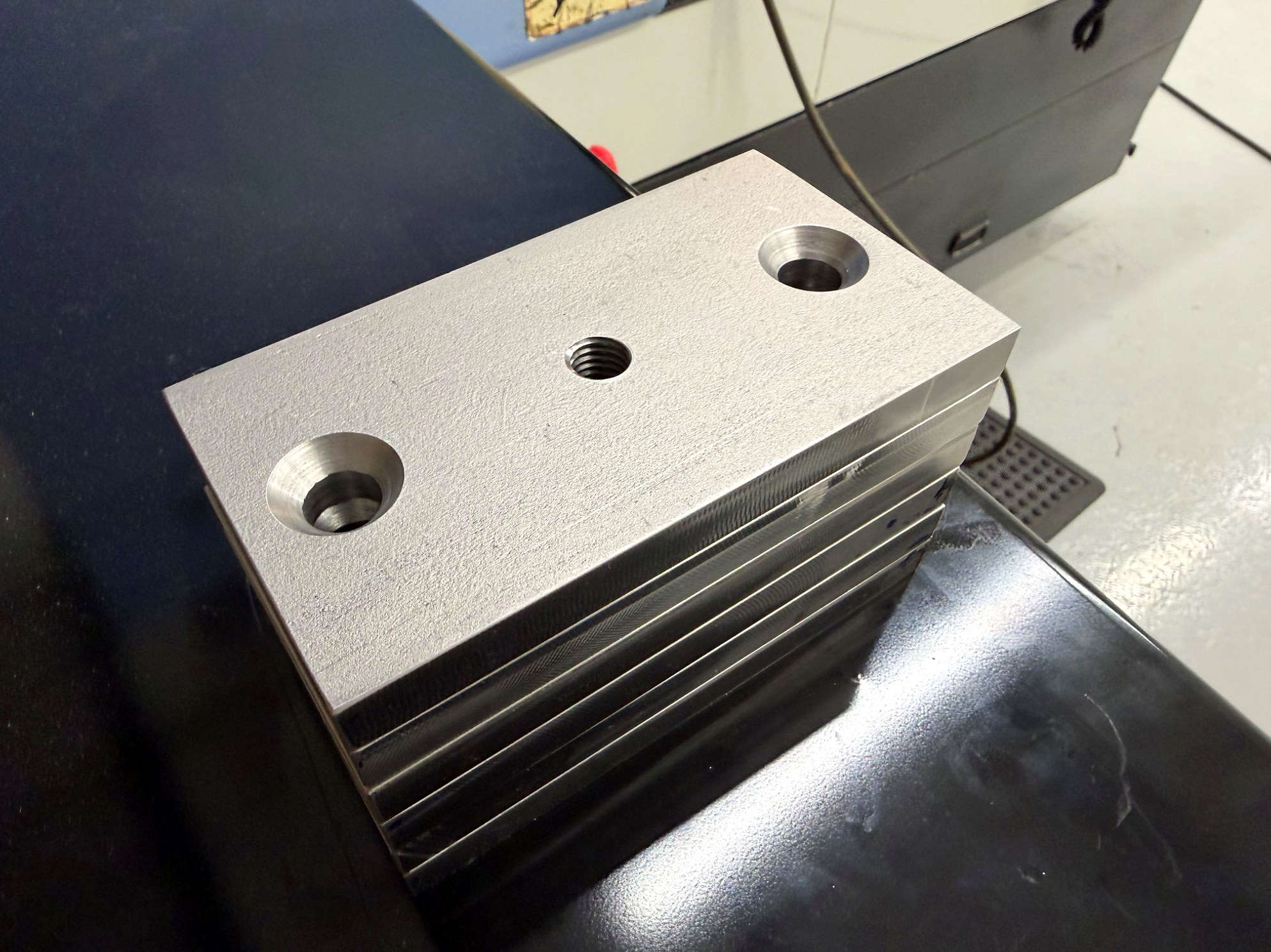 Milled plate with countersunk holes